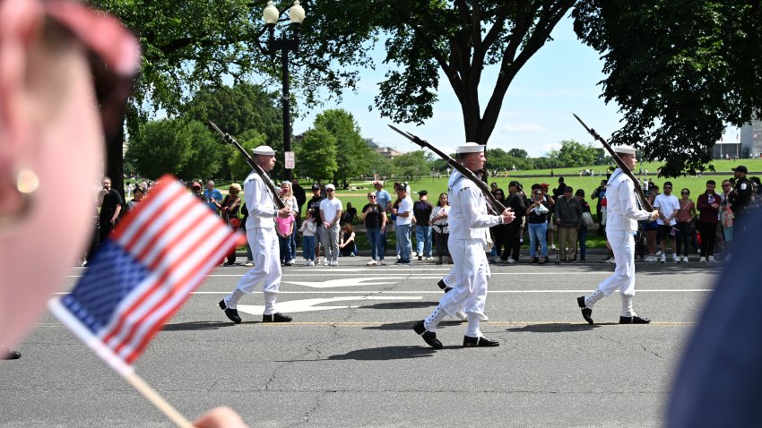 U.S. military members participate in the National Memorial Day Parade on Constitution Avenue
