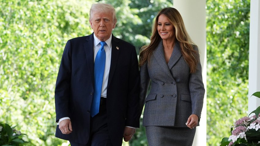President Donald Trump, left, and first lady Melania Trump arrive to speak during a bill signing event for the "Take it Down Act" in the Rose Garden of the White House, Monday, May 19, 2025, in Washington.