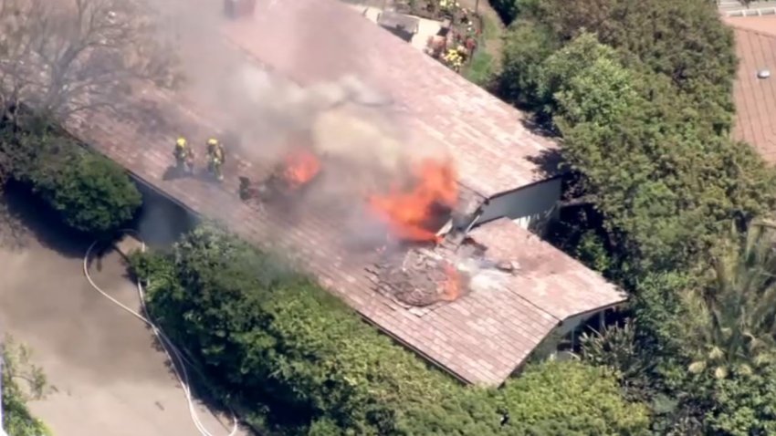 Firefighters knocked down a house fire Wednesday May 21, 2025 in Pacific Palisades.