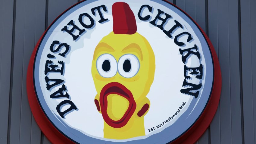 The Dave’s Hot Chicken logo is displayed at a Dave’s Hot Chicken restaurant on February 26, 2025 in Rosemead, California. 