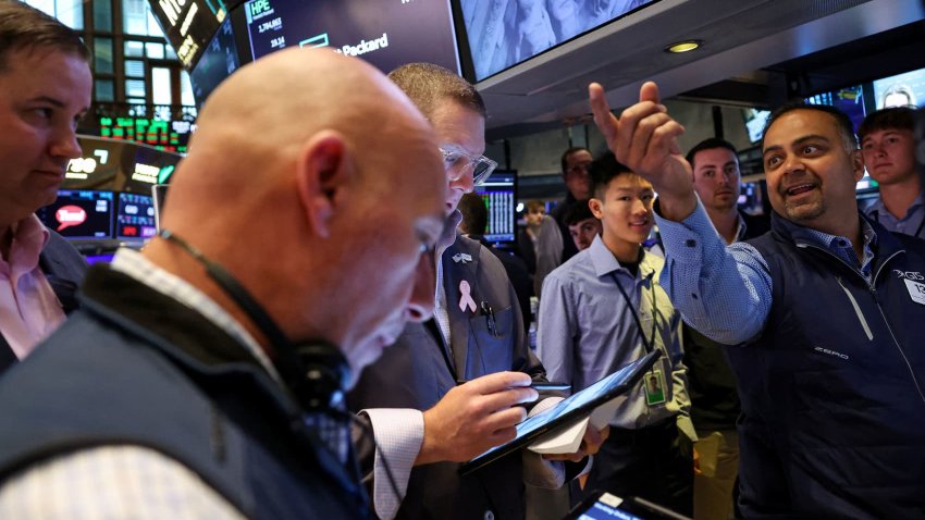 Traders work on the floor at the New York Stock Exchange (NYSE) in New York City, U.S., June 4, 2025.