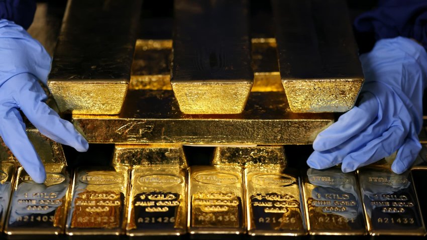 An employee arranges gold bars at the Italpreziosi SpA precious metals refinery plant in Arezzo, Italy, on Tuesday, May 6, 2025.