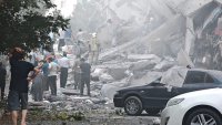 People look over damage to buildings in Nobonyad Square following Israeli airstrikes on June 13, 2025 in Tehran, Iran.
