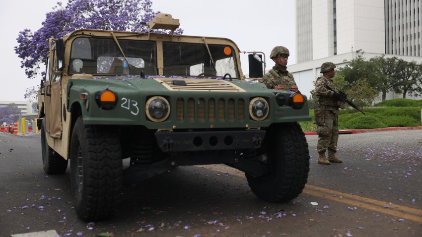 Members of the National Guard stand outside the Wilshire Federal building on Thursday, June 12, 2025.