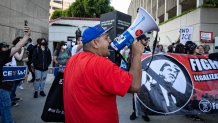 Los Angeles, CA - June 06: Demonstrators protest outside the Edward R. Roybal Federal Building and the Metropolitan Detention Center in response to ICE raids in Los Angeles on Friday, June 6, 2025 in Los Angeles, CA. (Jason Armond / Los Angeles Times via Getty Images)