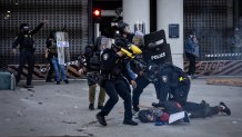 Los Angeles, CA - June 06: DHS police arrest at demonstrator during a protest outside the Metropolitan Detention Center in response to ICE raids in Los Angeles on Friday, June 6, 2025 in Los Angeles, CA. (Jason Armond / Los Angeles Times via Getty Images)