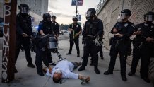 Los Angeles, CA - June 06: LAPD clear the streets and checks on a man that fell down as protesters gather in response to ICE raids in Los Angeles on Friday, June 6, 2025 in Los Angeles, CA. (Jason Armond / Los Angeles Times via Getty Images)