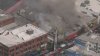 Commercial building fire sends thick smoke over downtown LA