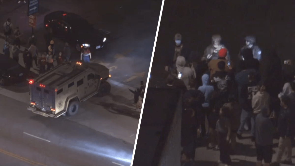 Protesters clash with federal agents at Chinatown parking lot