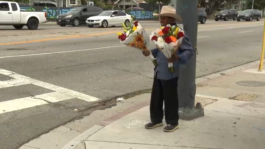 Edmundo, 82, sells bouquets of flowers he makes at a South Los Angeles street corner.