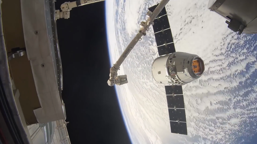 SpaceX Dragon capsule shown flying in space
