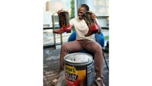 Jamaal Charles showing off the new Bush's BeanBQ Boots.