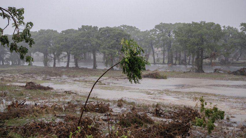 Severe thunderstorms prompt emergency flash flood warnings on the bank of the Guadalupe River during a search and recovery mission on July 13, 2025 in Kerville, Texas. More than 160 people are still missing after storm cells halted over the area, dumping nearly 15 inches of rain and causing a 22-foot rise along the Guadalupe River.