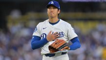 Los Angeles Dodgers pitcher Shohei Ohtani reacts after a base hit by Minnesota Twins' Ryan Jeffers during the third inning of a baseball game in Los Angeles, Monday, July 21, 2025. (AP Photo/Jayne Kamin-Oncea)