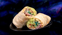 Halloween Time at the Disneyland Resort in Anaheim, Calif. begins Aug. 22, 2025 to Oct. 31, 2025. Oogie Boogie Burrito at Studio Catering Co.: Carne asada, French fries, spicy blue tortilla chips, pico de gallo, guacamole, and crema (David Nguyen/Disneyland Resort)