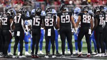 ATLANTA, GEORGIA - AUGUST 8: Atlanta Falcons and Detroit Lions players hold hands at midfield after Morice Norris #26 of the Detroit Lions sustained an injury during the fourth quarter of an NFL preseason football game at Mercedes-Benz Stadium on August 8, 2025 in Atlanta, Georgia. (Photo by Kevin Sabitus/Getty Images)