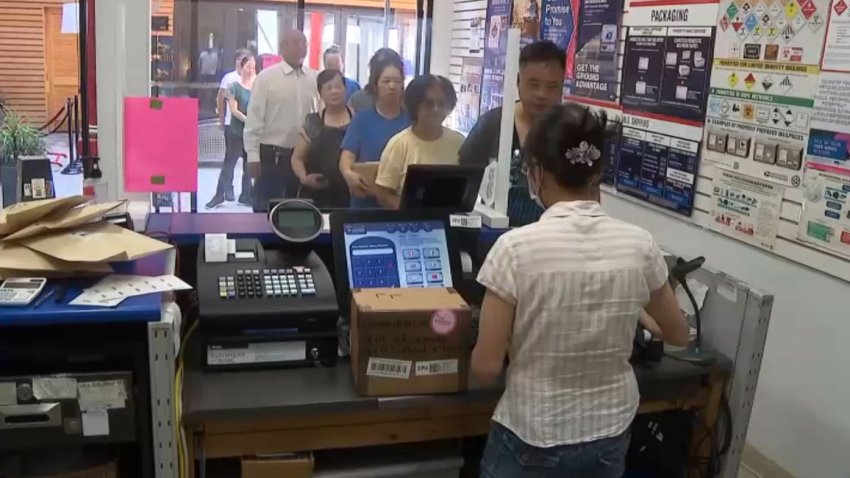 Customers visit a post office Aug. 26, 2025 in Los Angeles' Chinatown.