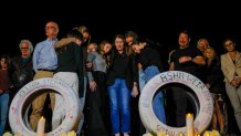 Malibu, CA, Tuesday, November 14, 2023 - A traffic safety group, Streets Are For Everyone hosts a ``Ghost Tire Memorial'' placement in memory of the victims of a reckless driver who killed four Pepperdine students. Parents, friends and classmates attend the ceremony, adding written thoughts to the tires, placed alongside Pacific Coast Highway. (Robert Gauthier/Los Angeles Times via Getty Images)
