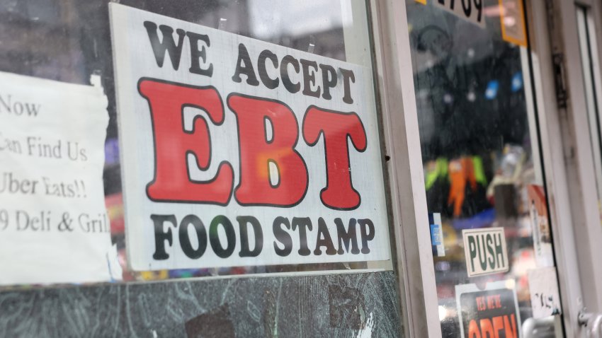 An EBT sign is displayed on the window of a grocery store on October 30, 2025 in the Flatbush neighborhood of the Brooklyn borough in New York City.