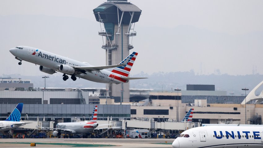 LOS ANGELES, CALIFORNIA – NOVEMBER 12:  An American Airlines plane takes off near the air traffic control tower at Los Angeles International Airport (LAX) on November 12, 2025 in Los Angeles, California. The FAA (Federal Aviation Administration) has reduced flights by 10 percent in 40 major airports around the country, including LAX, with airlines warning that flight disruptions could continue even after the end of the federal government shutdown as the Thanksgiving holiday approaches.  (Photo by Mario Tama/Getty Images)