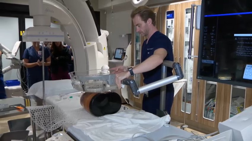 A healthcare worker with Sharp Memorial Hospital demonstrates how a new technology called histotripsy is used to destroy liver cancer cells on Nov. 12, 2025. (NBC 7 San Diego)