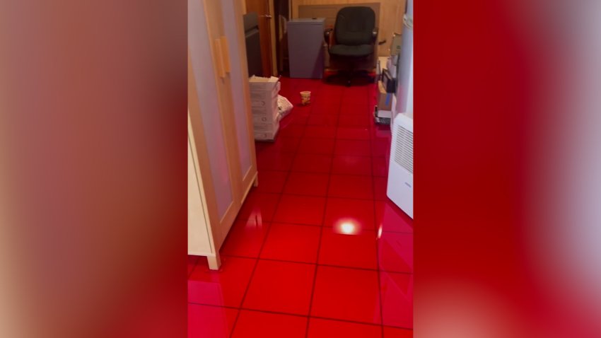 A still from cellphone video shows oil all over the floor of a home in Medford, Massachusetts, on Nov. 24, 2025.