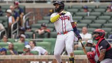 Sep 24, 2025; Cumberland, Georgia, USA; Atlanta Braves designated hitter Marcell Ozuna (20) hits a home run against the Washington Nationals during the eighth inning at Truist Park. Mandatory Credit: Dale Zanine-Imagn Images