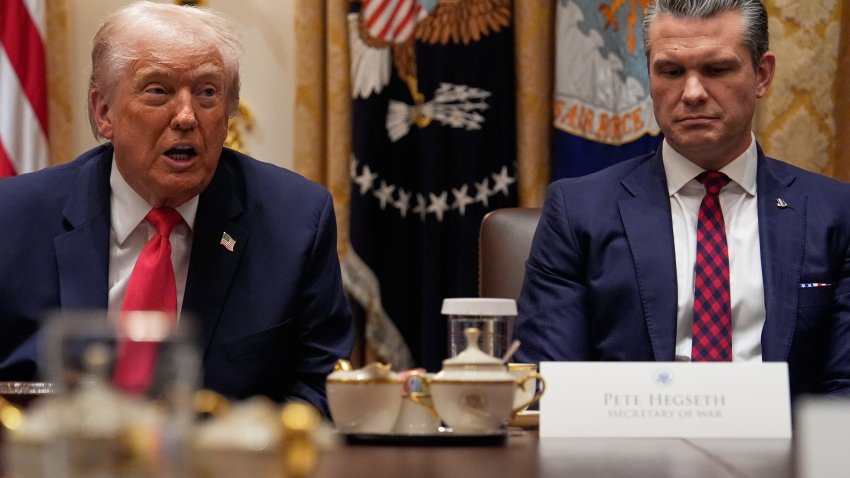 President Donald Trump speaks during a Cabinet meeting at the White House, Tuesday, Dec. 2, 2025, in Washington, as Secretary of Defense Pete Hegseth looks on.