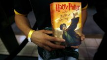 NEW YORK - JULY 21:  Joey Tartaglia, the first fan in the Barnes & Noble Booksellers Union Square to purchase author J.K. Rowling's novel "Harry Potter and the Deathly Hallows" holds his copy of the book July 21, 2007 in New York City. Worldwide anticipation and hype surround the publication of 'Harry Potter and the Deathly Hallows,' the seventh and final book in author J.K. Rowling's fantasy series. (Photo by Michael Nagle/Getty Images)
