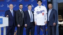 LOS ANGELES, CALIFORNIA - JANUARY 22: (L-R) President and CEO Stan Kasten, Executive Vice President and General Manager Brandon Gomes, President Baseball Operations Andrew Friedman,  Pitcher Roki Sasaki and Manager Dave Roberts speaks pose during a Los Angeles Dodgers press conference at Dodger Stadium on January 22, 2025 in Los Angeles, California. (Photo by Kevork Djansezian/Getty Images)