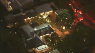 An aerial view of a Brentwood home where paramedics and police responded Sunday afternoon after reports that 2 individuals were found dead inside.