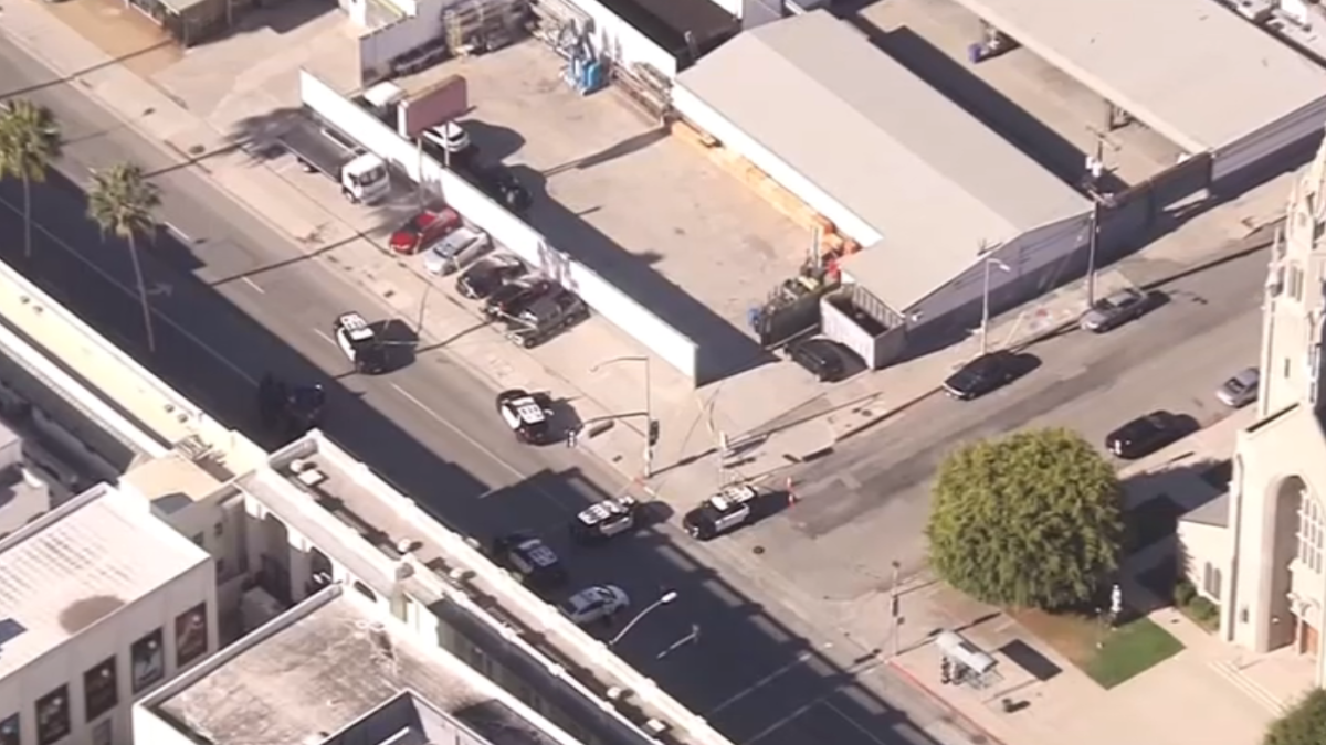 A man was found dead Monday morning inside a car parked in a lot in Los Angeles' Palms area.