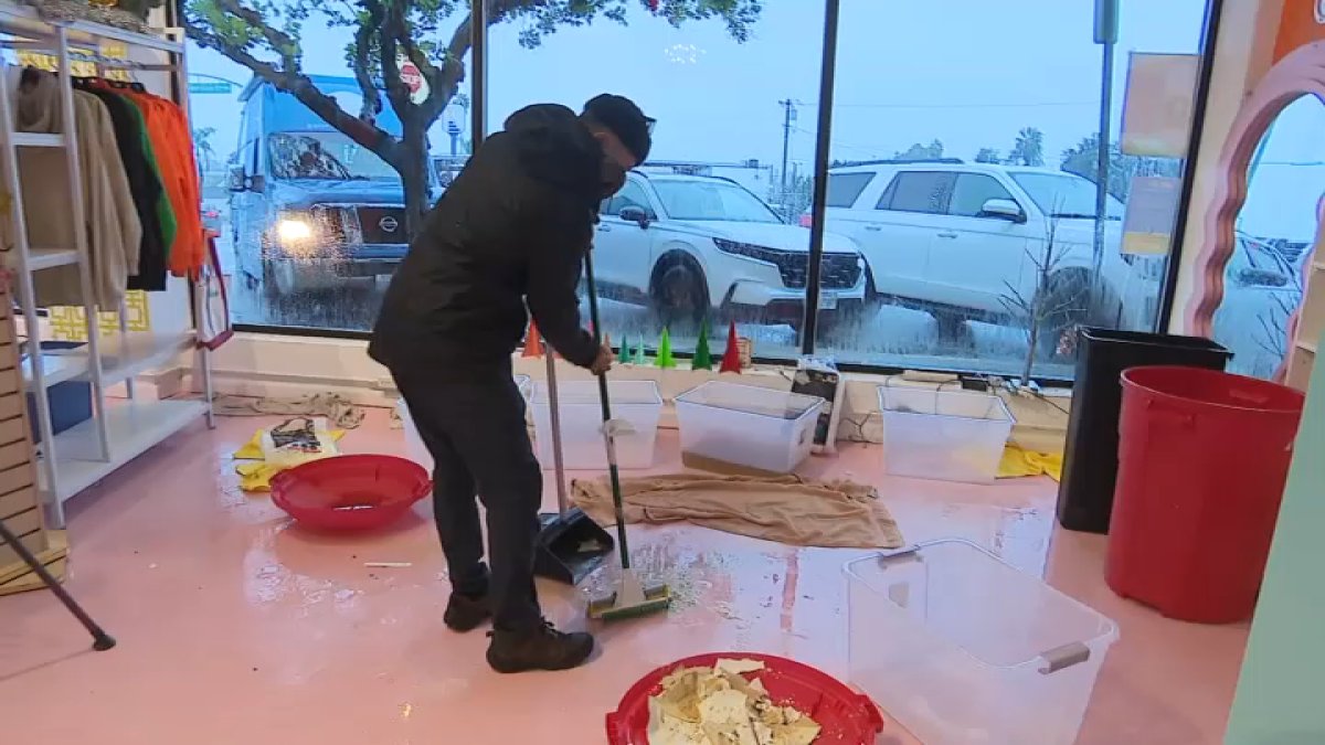 ‘It's about giving back.' Volunteers help Eaton Fire-impacted business after storm flood