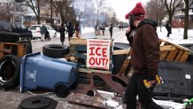 Demonstrators gather at the street where 37-year-old Renee Nicole Good was shot and killed at point blank range on January 7 by a US Immigration and Customs Enforcement (ICE) agent as she apparently tried to drive away from agents who were crowding around her car, in Minneapolis, Minnesota, on January 8, 2026. A US Immigration and Customs Enforcement (ICE) agent shot and killed an American woman on the streets of Minneapolis January 7, leading to huge protests and outrage from local leaders who rejected White House claims she was a domestic terrorist. The woman, identified in local media as 37-year-old Renee Nicole Good, was hit at point blank range as she apparently tried to drive away from agents who were crowding around her car, which they said was blocking their way. (Photo by CHARLY TRIBALLEAU / AFP via Getty Images)