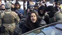 MINNEAPOLIS, UNITED STATES - JANUARY 13: Federal Agents arrest a woman after smashing her car windows for allegedly blocking the street during an Immigration Enforcement Operation in Minneapolis, Minneapolis, MN, U.S., January 13, 2026. (Photo by Mostafa Bassim/Anadolu via Getty Images)