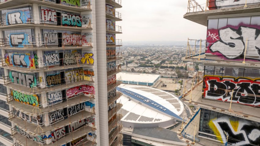 The graffiti covered Oceanside Plaza tower in Los Angeles, California, US, on Friday, May 17, 2024. Even as many cities have returned to post-pandemic normalcy and employers have enacted stricter in-person work policies, office-rent growth in the central business districts of cities such as LA have lagged behind outlier areas, according to brokerage Savills. Photographer: Kyle Grillot/Bloomberg via Getty Images