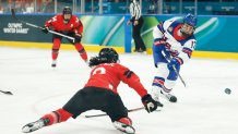 Britta Curl of the United States takes a shot against Canada
