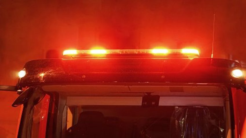 Red lights of a fire engine at night.