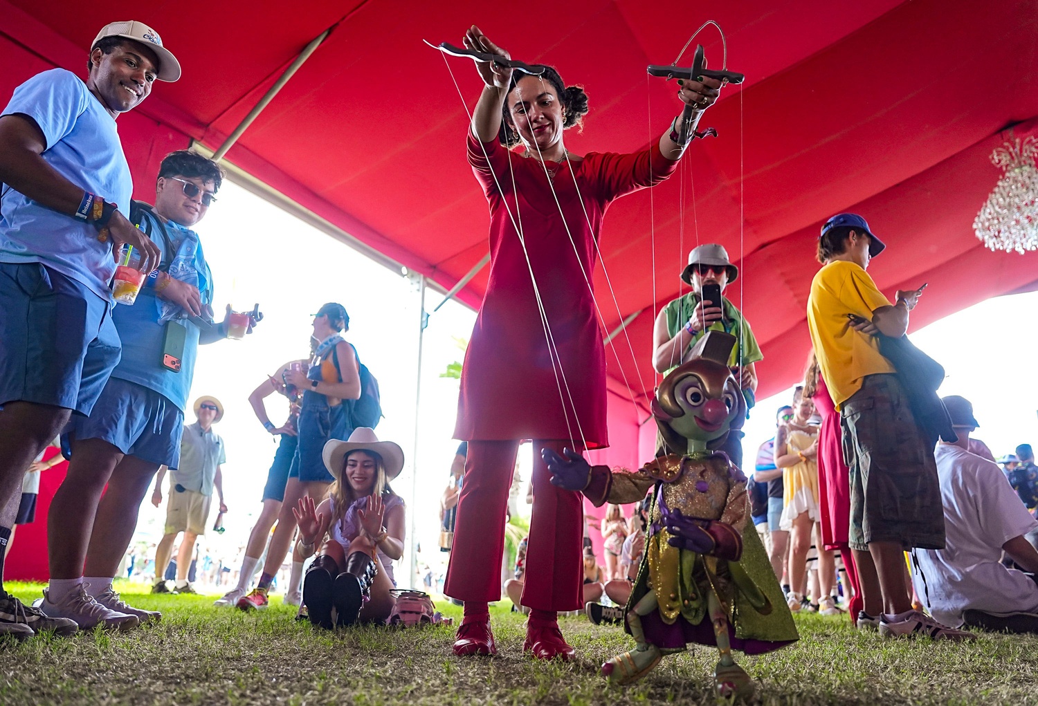 One of The Bob Baker Marionette Theater puppets works the crowd before their set during Weekend 1 of the Coachella Valley Music and Arts Festival in Indio, Calif., Friday, April 10, 2026.