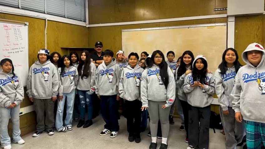 John Muir Middle School teacher Jose Alvarez and his students pose for a photo.
