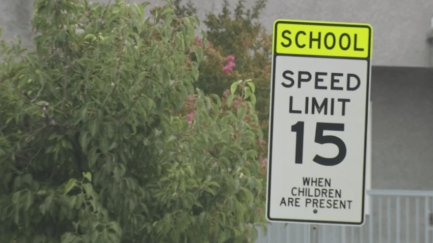 A speed limit sign in a school zone.