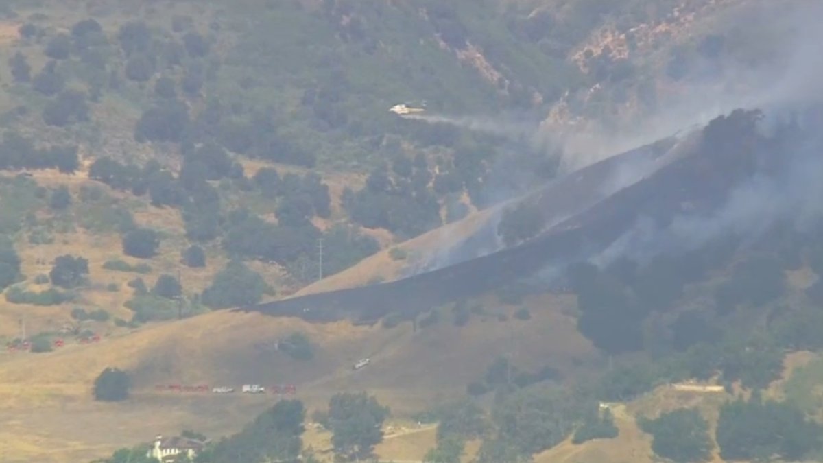 Firefighters attack brush fire on Calabasas hillside