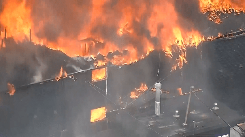 Dallas Fire-Rescue works to put out a 5-alarm fire at a two-story apartment building that caught fire in a natural gas explosion on Thursday, May 28, 2026.