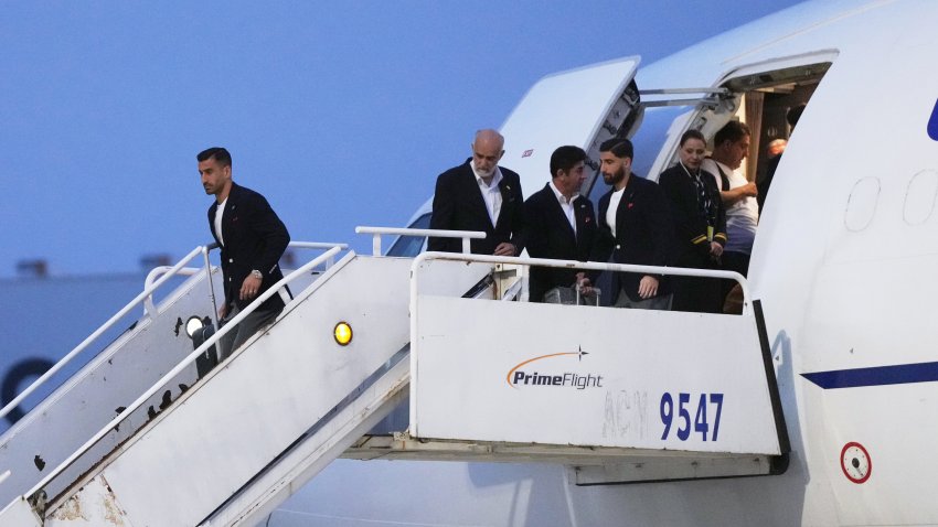 Iran's Ehsan Hajisafi, left, arrives with his teammates for the World Cup soccer tournament in Tijuana, Mexico, Sunday, June 7, 2026. (AP Photo/Gregory Bull)