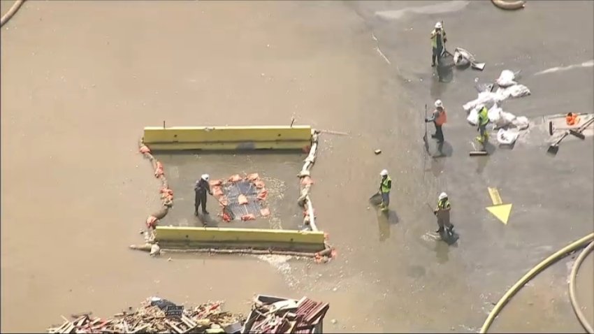 Crews clean up the Lineage warehouse facility in Boyle Heights on Sunday, June 28, 2026.