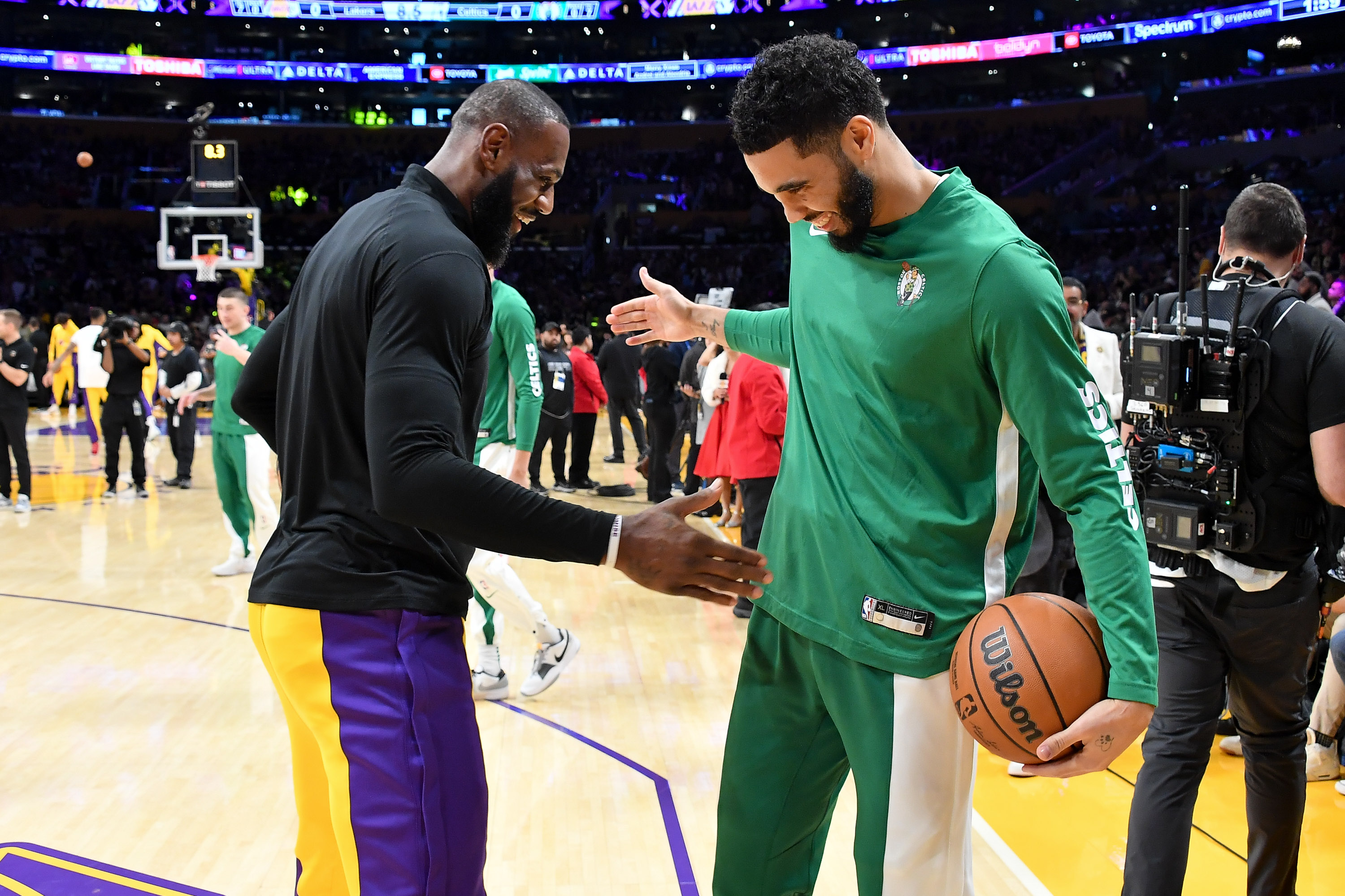 LOS ANGELES, CALIFORNIA – DECEMBER 25: LeBron James #23 of the Los Angeles Lakers and Jayson Tatum #0 of the Boston Celtics interact prior to their basketball game at Crypto.com Arena on December 25, 2023 in Los Angeles, California. NOTE TO USER: User expressly acknowledges and agrees that, by downloading and or using this photograph, User is consenting to the terms and conditions of the Getty Images License Agreement. (Photo by Allen Berezovsky/Getty Images)