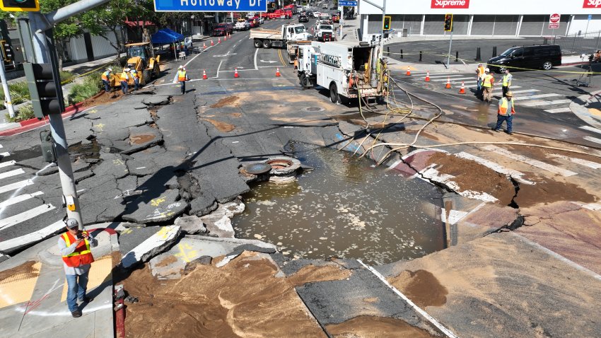West Hollywood, CA – July 16, 2026: An aerial view of workers viewing a broken water main at Sunset Boulevard and Holloway Drive in West Hollywood that sent water gushing down many streets, closing several of them Thursday, July 16, 2026. The Los Angeles County Fire Department said at 4:37 a.m. that a major water main was broken in the area of Palm Avenue and Harratt Street. (Allen J. Schaben / Los Angeles Times via Getty Images)