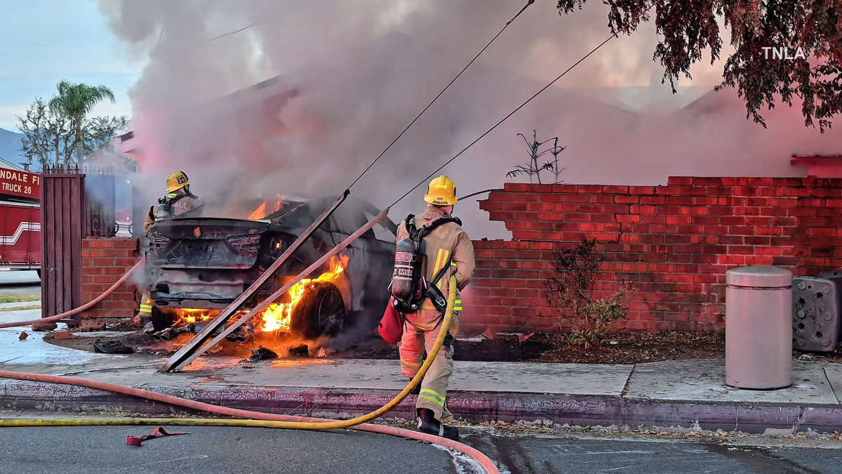 Car catches fire after crashing into brick wall of home in Glendale
