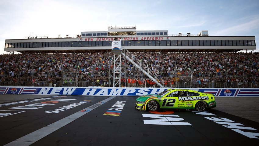 Ryan Blaney drives as fans cheer