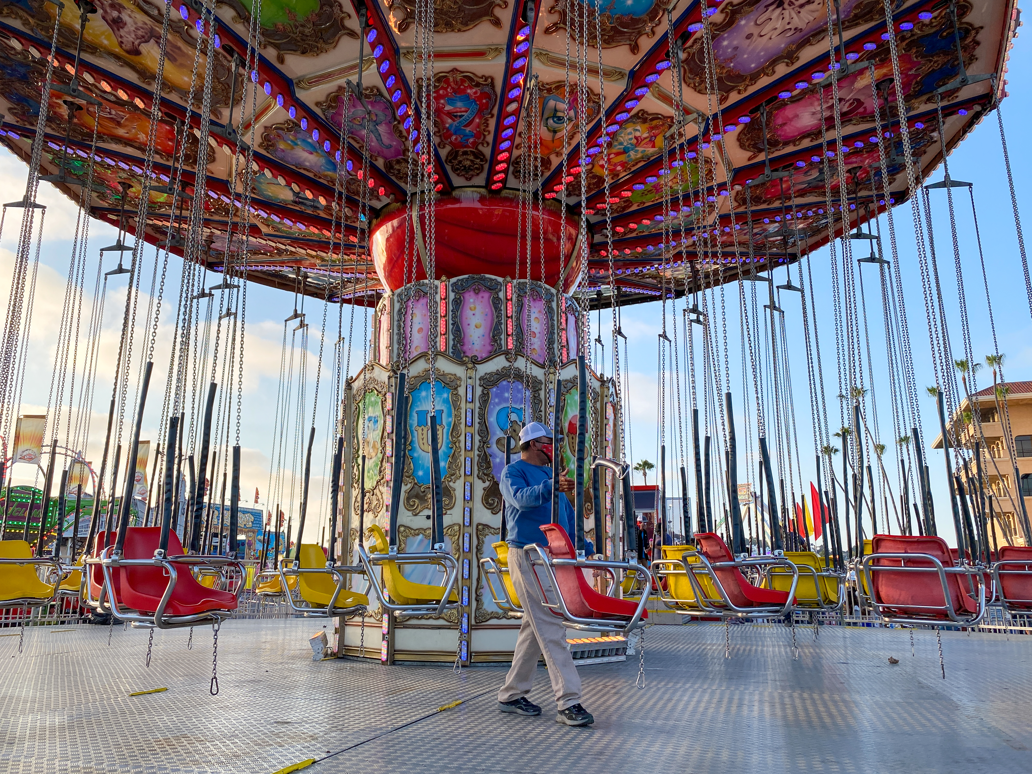 Wave swinger ride against blue sky at Del Mar, San Diego county fair, USA, 13th July, 2021
